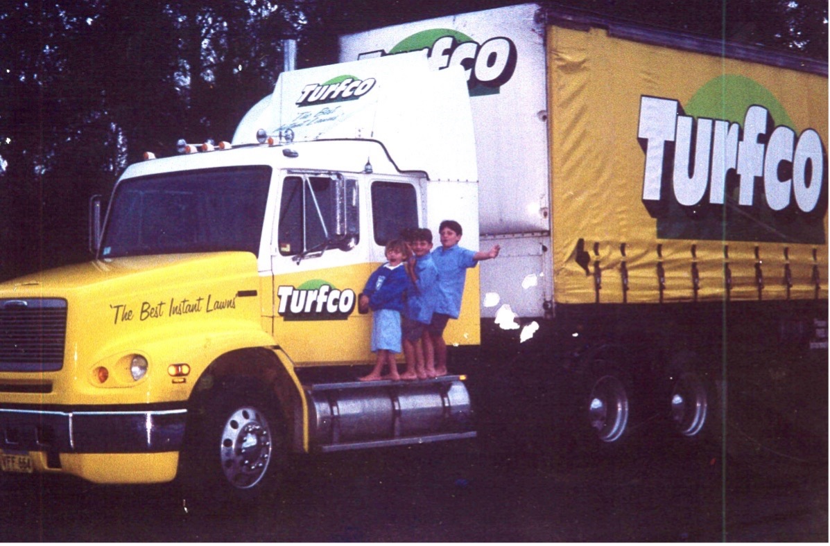 Kids sitting on vintage truck
